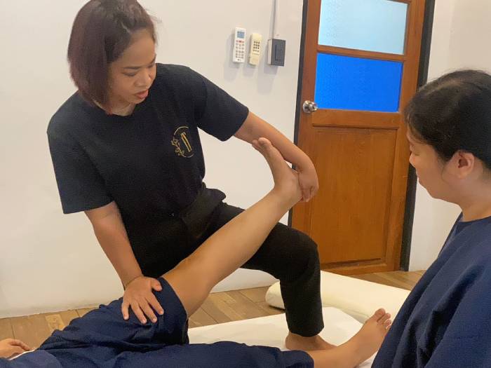 Traditional Thai massage assisted stretch practice