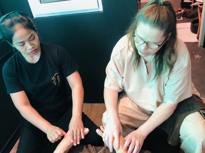 Foot massage private course practice at Nuad Thai School