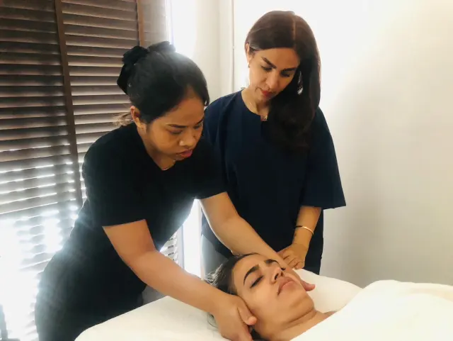 Smiling scalp massage practice