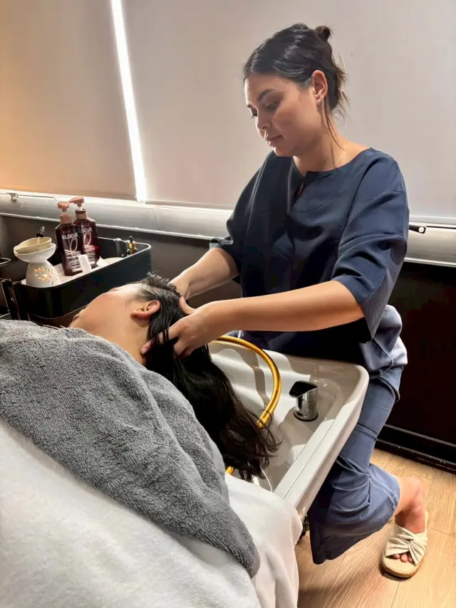 Scalp massage at the basin