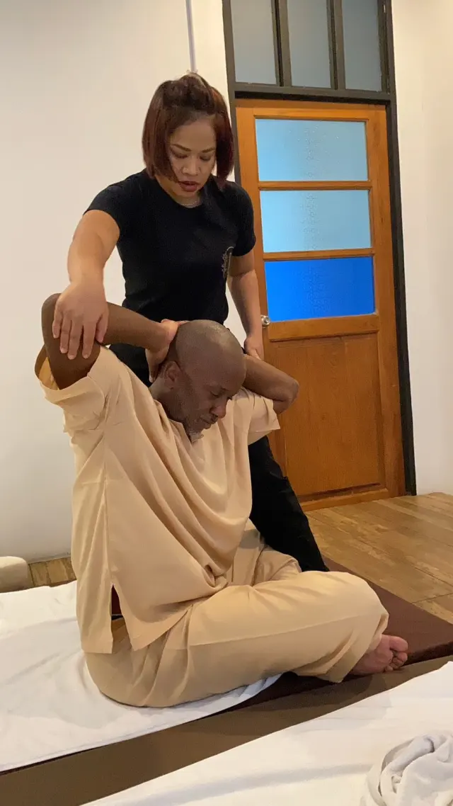 Guided seated arm stretch