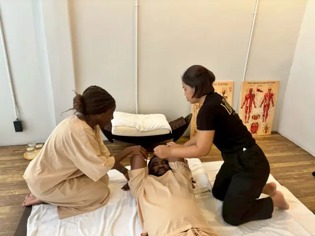 Supine arm stretch coaching