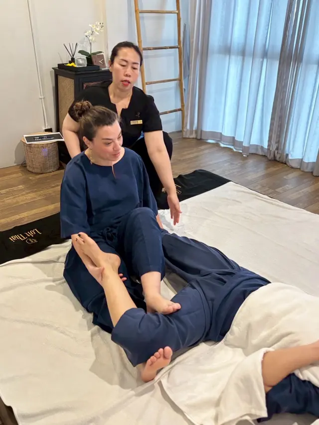 Seated leg stretch demonstration
