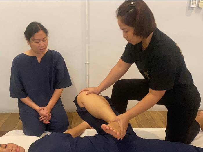 Instructor-led Thai massage practice in Bangkok